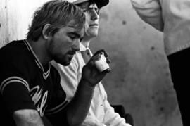 A man takes a drink during a St. Cloud State University baseball game against Northern State University