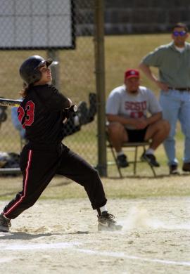 Softball player Mary Libbesmeier watches a batted ball during a softball game, St. Cloud State University