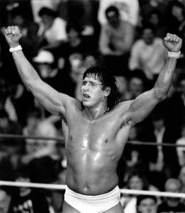 Tito Santana raises his hands after his wrestling match at Halenbeck Hall (1965), St. Cloud State University