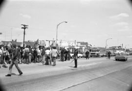 Protestors march on sidewalk, Day of Peace protest