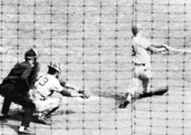 "Denny Carruth lines one down the first base line in a closely watched play by catcher and umpire," St. Cloud State University