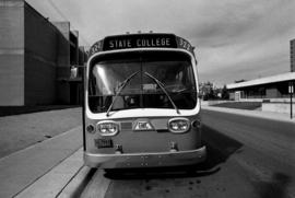 Bus parked outside of Atwood Memorial Center (1966), St. Cloud State University