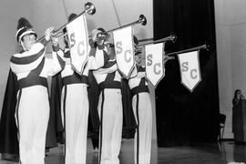 Marching band members announce arrival with musical instruments, St. Cloud State University