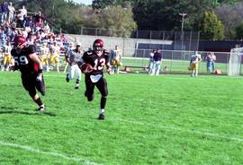 Keith Heckendorf plays quarterback during a football game against Augustana College, St. Cloud State University