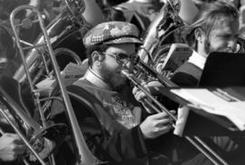 Marching band members play musical instruments at the homecoming football game, St. Cloud State University