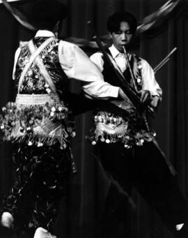 Sao Xiong and Chue Moua play queej musical instruments at Hmong Night at Atwood Memorial Center (1966), St. Cloud State University