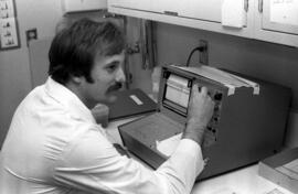 Medical Technology student uses scientific equipment, St. Cloud State University