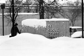 St. Cloud State University sign covered with snow