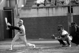 Baseball player Pete Pratt swings a bat during a baseball game, St. Cloud State University