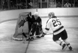 A hockey player chases for the puck, St. Cloud State University