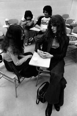 People gather togther in a classroom before a Shawn Phillips concert, St. Cloud State University