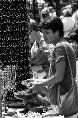 A woman looks at necklaces, Lemonade Concert and Art Fair, St. Cloud State University