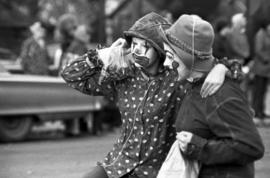 Two clowns march in the homecoming parade in downtown St. Cloud, St. Cloud State University