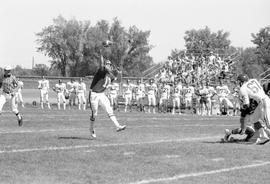 Quarterback Steve Erickson throws a pass against the University of South Dakota, St. Cloud State University