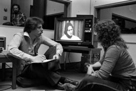 Psychology students sit together viewing a television, St. Cloud State University