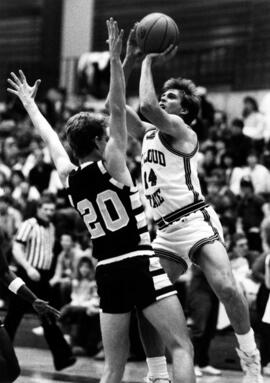 Basketball player Barry Wohler takes a shot during a game, St. Cloud State University