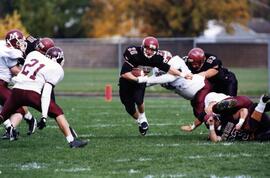 Randy Martin runs with a football during a game, St. Cloud State University