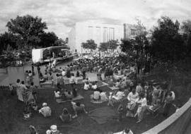 People listen to a concert in front of Stewart Hall (1948), St. Cloud State University