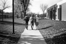 Students walk west along a path between the Performing Arts Center (1968) and Administrative Services (1975), St. Cloud State University