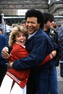 Chubby Checker hugs a cheerleader at Selke Field (1937), St. Cloud State University