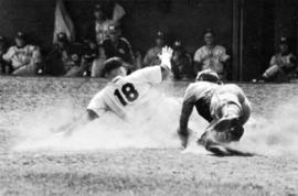 "Merl Soderstrom dives in an attempt to stop a run against St. Cloud. The runner was called out," St. Cloud State University