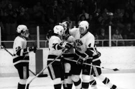 St. Cloud State hockey player Tony Schmalzbauer and teammates celebrate during a game against Gustavus Adolphus