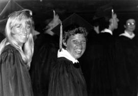 Two women at commencement, St. Cloud State University