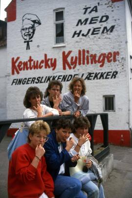 St. Cloud State students stand in front of a Kentucky Fried Chicken sign in Denmark