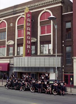 St. Cloud State football team gathers under the Paramount Theatre marquee
