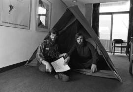 Dennis Caneff and Rolf Hagberg pose in their tent in preparation for their trip down the Mississippi River
