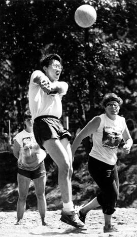 Wing Ho hits a volleyball at the Pirates Cove Supper Club volleyball tournament