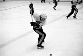 St. Cloud State hockey player Bob Motzko takes a shot during a men's hockey game against Bemidji State University