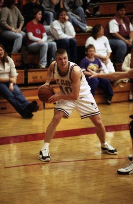 Jason Kron holds the basketball during a basketball game against Morningside College, St. Cloud State University