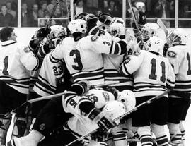 Hockey players celebrate a victory over Salem State College that earned them a trip to the NCAA Division III Final Four, St. Cloud State University