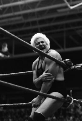 Wrestler Ken Patera reacts to pain during match at Halenbeck Hall (1965), St. Cloud State University