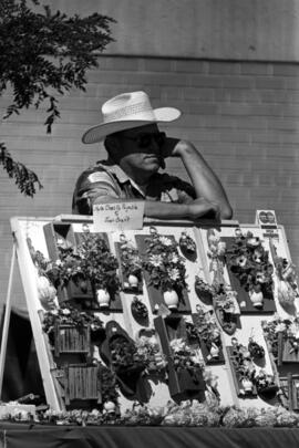 An art vendor waits for customers, Lemonade Concert and Art Fair, St. Cloud State University