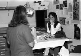 Mary Shrode helps a student, St. Cloud State University