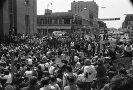 Protestors gather at a building, Day of Peace protest, St. Cloud State University