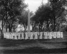 Female students gather and march around a May Pole, St. Cloud State University