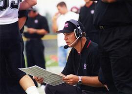 Randy Hedberg coaches during a football game, St. Cloud State University