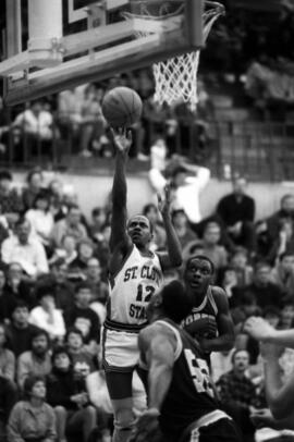 Basketball player Cleveland Barnes takes a shot during a game against the University of North Dakota, St. Cloud State University