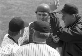 Denny Lorsung, Pete Pratt, and Jeremy Mendel confer on the mound, St. Cloud State University