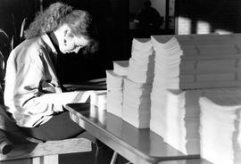 Woman reads a brochure, St. Cloud State University