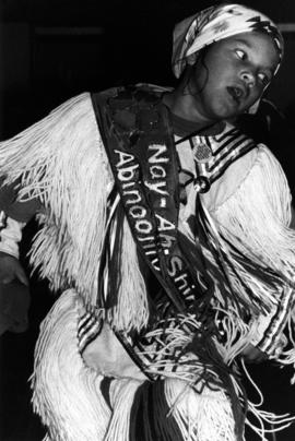 A girl dances at a pow wow, St. Cloud State University