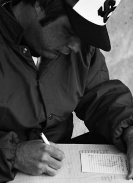 Denny Lorsung fills out a line up card before a St. Cloud State University baseball game against Augsburg College