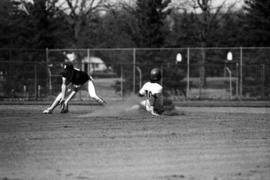 Jim Eisenreich slides into second base in a St. Cloud State University baseball game against the University of Minnesota-Duluth