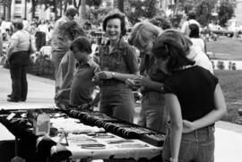 People inspect merchandise, Lemonade Concert and Art Fair, St. Cloud State University
