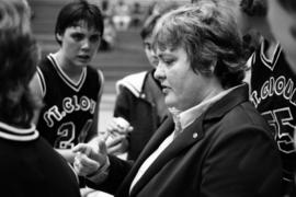 Basketball coach Gladys Ziemer talks to her players, St. Cloud State University