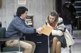 Librarian Keith Ewing helps student Renee Rude, St. Cloud State University