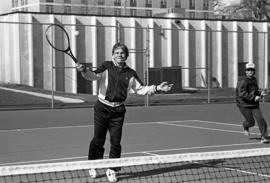 Jerry Anderson hits a tennis ball, St. Cloud State University